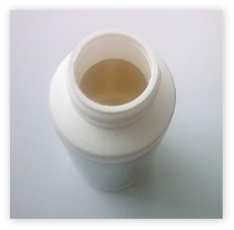 Otevřená lahvička Kirkladn Minoxidilu